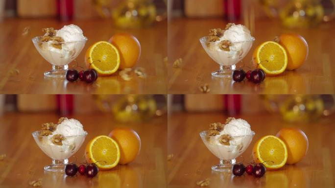 核桃玻璃碗里的冰淇淋。木制桌子上的橙色和樱桃。冰淇淋冰淇淋的制备。甜冷甜点。