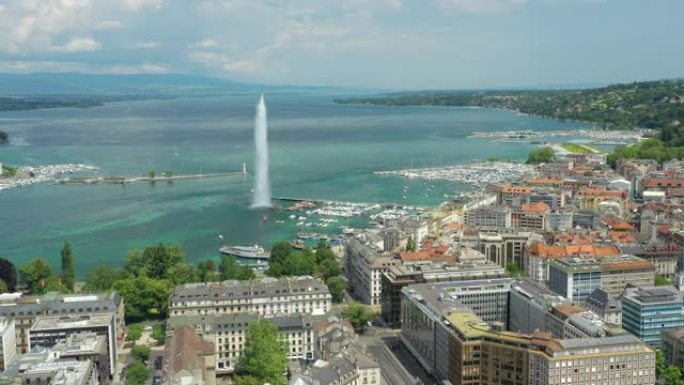 阳光明媚的一天飞越日内瓦中心城市景观湖边喷泉湾空中全景4k瑞士