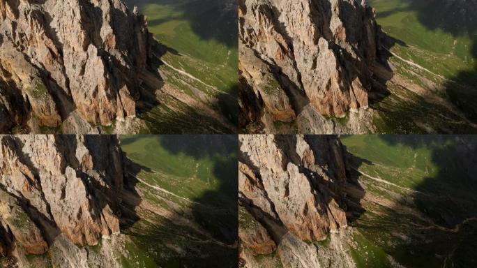日落时无人机飞越尖锐的岩石露头的鸟瞰图。用于极端登山的陡峭的岩层山。飞行穿越旅行视频