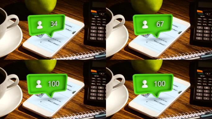 桌子上有水果，计算器，一杯咖啡和一个带有个人资料图标和数字的电话