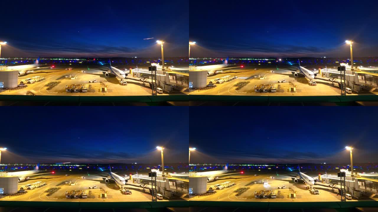 黄昏时的机场黑夜灯光客机