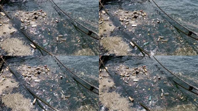 塑料瓶，袋子废物漂浮在水中。海洋水污染概念。塑料污染危机
