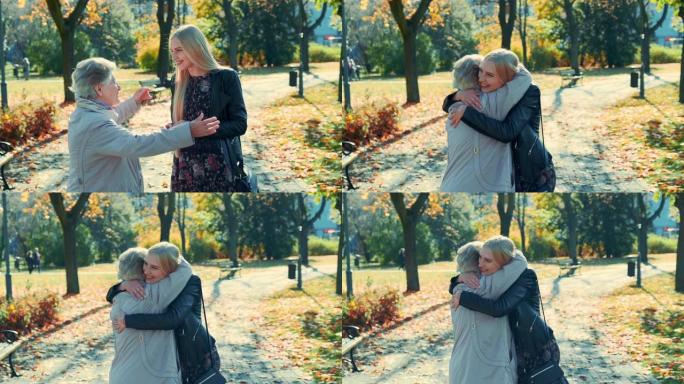祖母和孙女在公园里互相拥抱