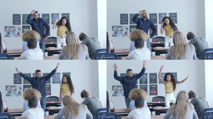 一位男老师向一位学生学习舞蹈课