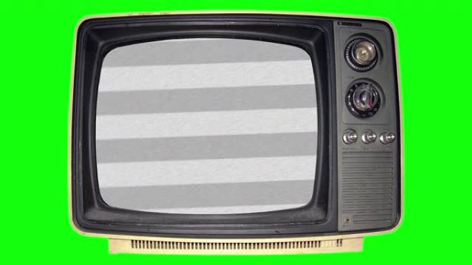绿屏背景下尘土飞扬的旧电视上的白噪声静电
