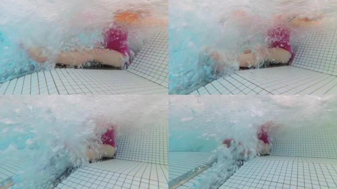 水疗池中女孩在喷水热水浴缸气泡中放松的水下视图