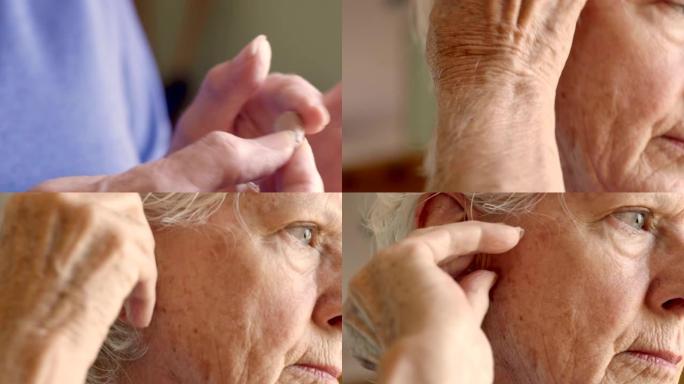 一位70多岁的老妇调整了助听器并将其放在耳朵里