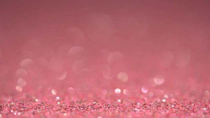 粉红色明亮美丽的节日纹理在运动。魔法波克背景
