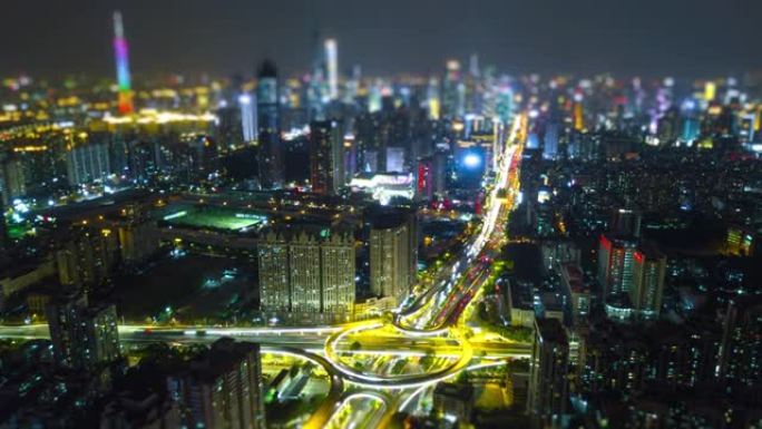 夜间照明广州城市景观交通路口市中心空中倾斜移动全景4k延时中国