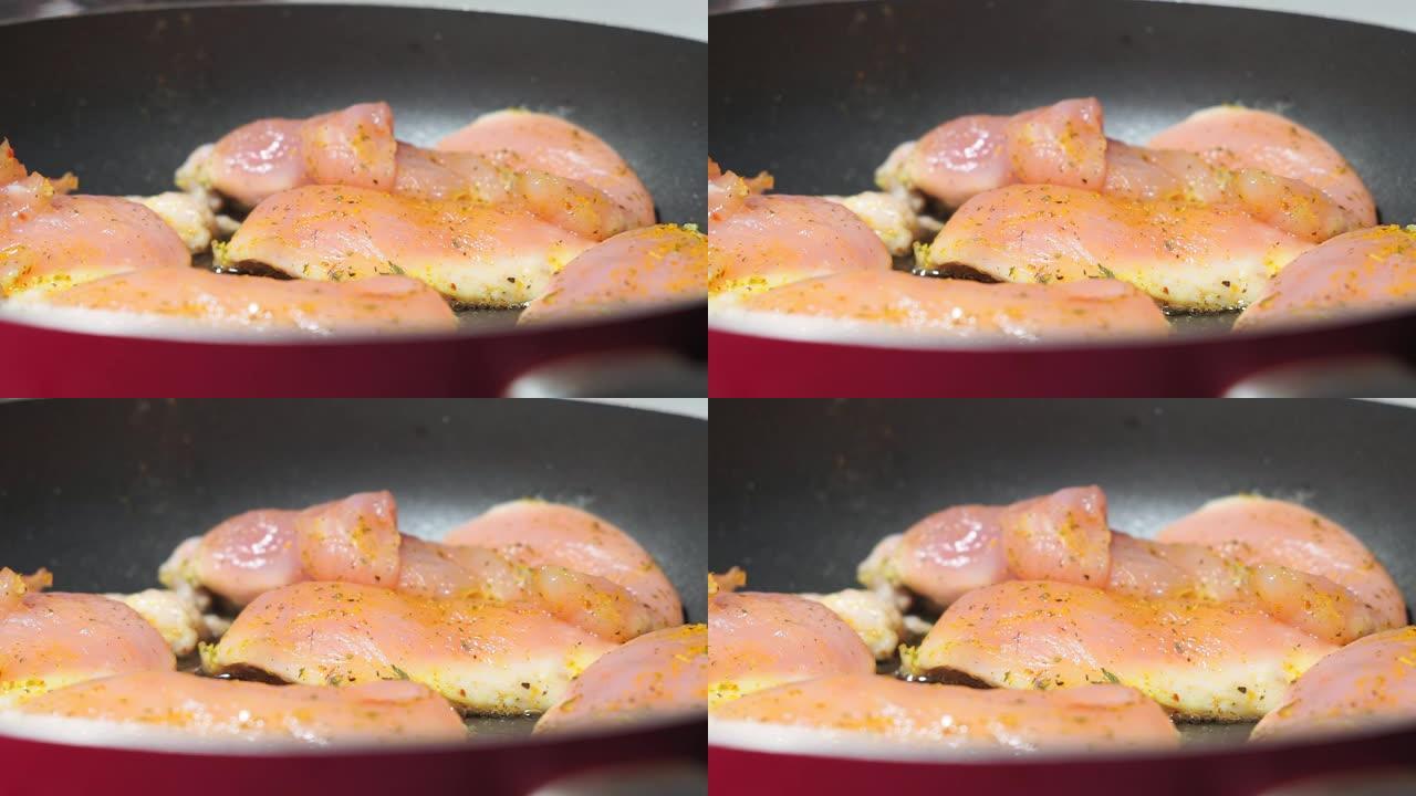 生鸡肉，用香辛料在平底锅里油炸的鱼片。咖喱的辣味，烹饪