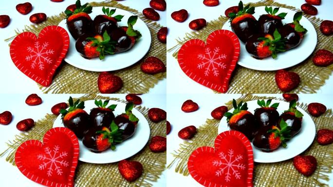 情人节那天，外面放着一盘巧克力草莓，上面放着红心的桌子。