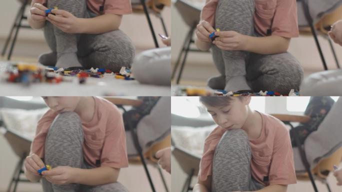 两个孩子玩塑料块的特写镜头