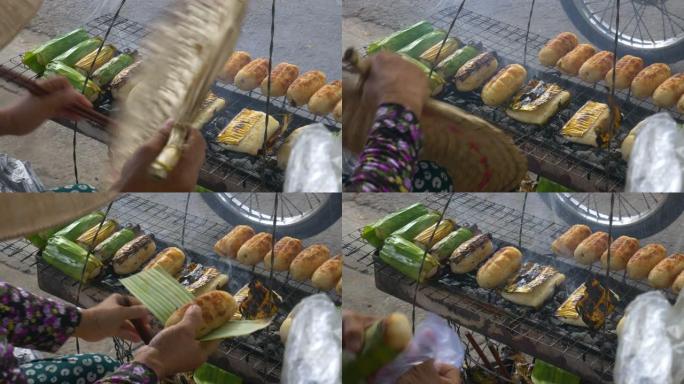 越南街头美食，烤米饭卷，里面装满香蕉。特写女人身体部分在街上准备早餐。