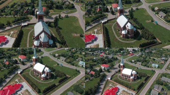 在白俄罗斯风景如画的乡村中，无人机在哥特式教堂周围飞行
