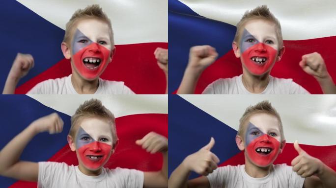 捷克共和国国旗背景上的快乐粉丝。有着民族色彩的脸的快乐男孩。