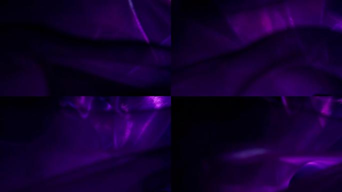 紫色照明旋转丝绸紫色光谱背景虚无三维空间
