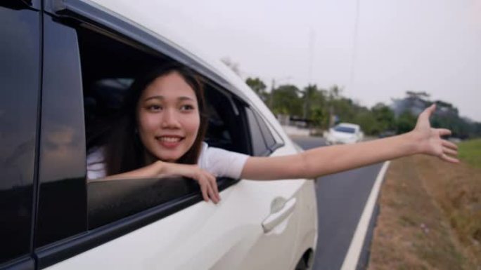 掀背车旅行驾驶公路旅行年轻女子暑假在汽车日落在假期和放松获得气氛，去目的地。慢动作C4K电影镜头