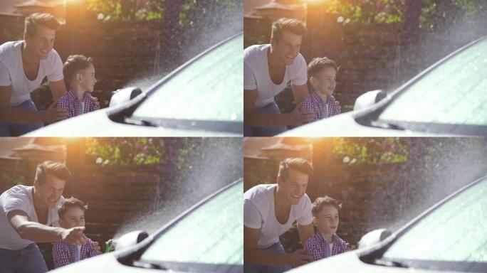爸爸和儿子一起洗车。慢动作