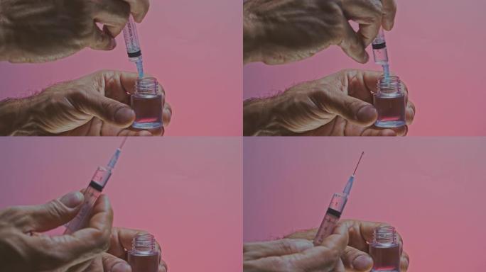 用注射器从瓶子里取出疫苗