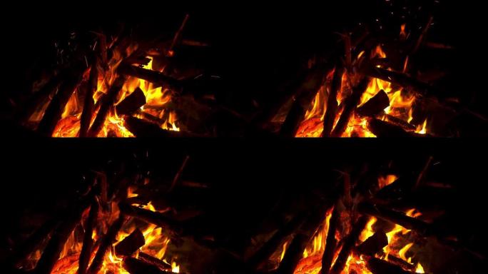燃烧柴火特写，慢动作。露天燃烧篝火。野餐时着火。桦木木柴。火焰舌头