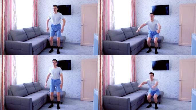有趣的书呆子男人在客厅在家做蹲坐运动。有趣的是，运动前拉起短裤。