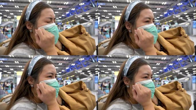 场景慢动作亚洲妇女戴口罩保护电晕病毒在机场