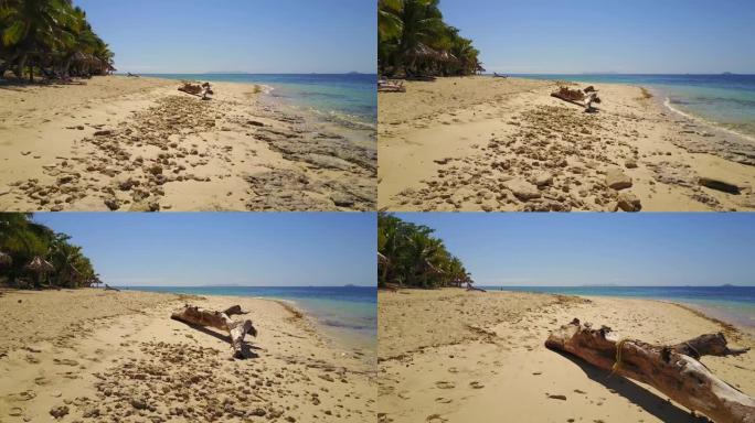 斐济金银岛4k岩石海滩，有大漂流木