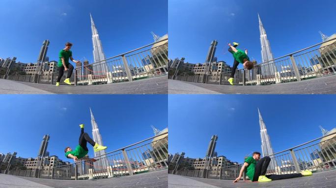 在迪拜的城市景观背景下，男子用跳绳跳跃。慢动作