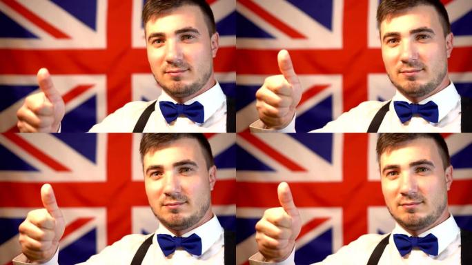 一个快乐的英国人的肖像，他在英国国旗的背景上竖起大拇指。