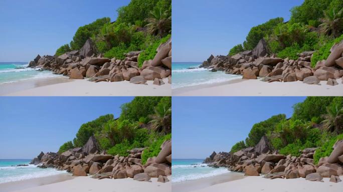 美丽的热带海滩娇小的Anse雕刻花岗岩岩石和棕榈树-拉迪格岛，塞舌尔，印度洋群岛。