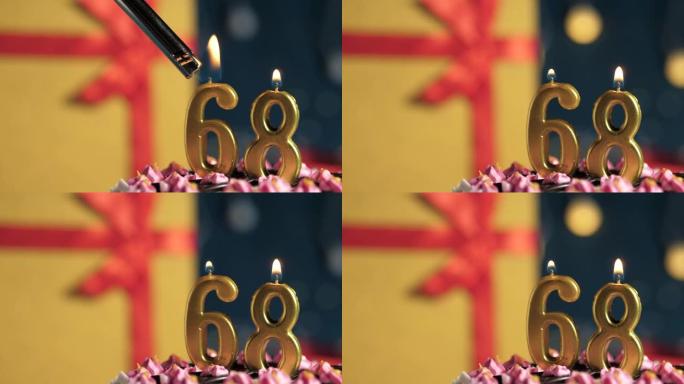生日蛋糕68号点火器燃烧的金色蜡烛，蓝色背景礼物黄色盒子用红丝带绑起来。特写和慢动作