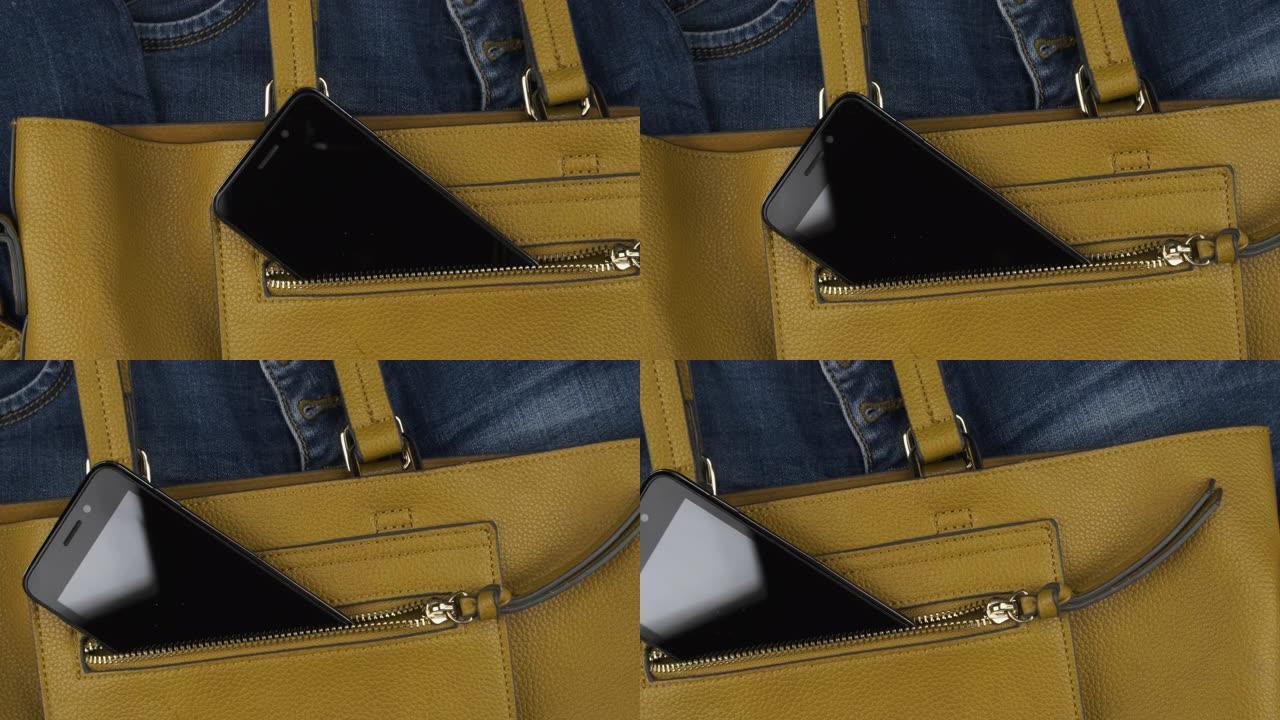 手机从女人包的口袋里伸出来。全景。