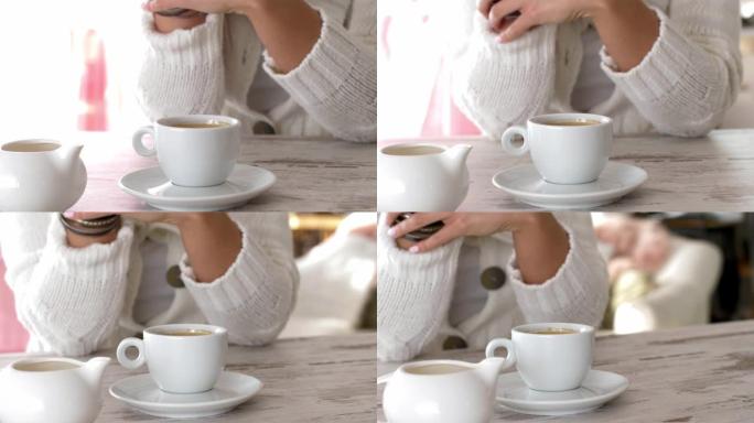 在咖啡休息时，无法辨认的年轻女子在玩手镯的中段