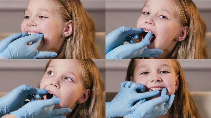 正畸医生在女孩的牙齿上放置一个特殊的板以使其对齐，从而在儿童时期矫正牙齿