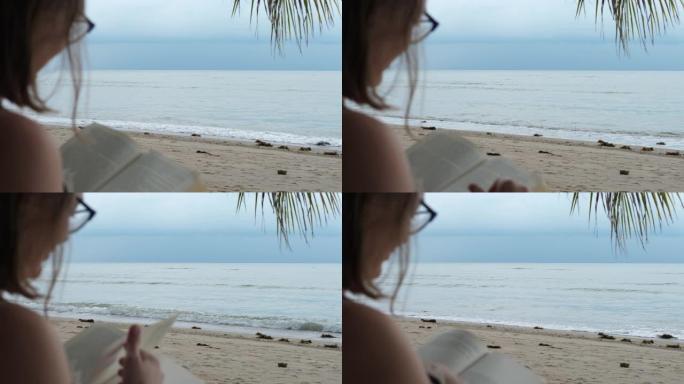 学生女性在海边看书