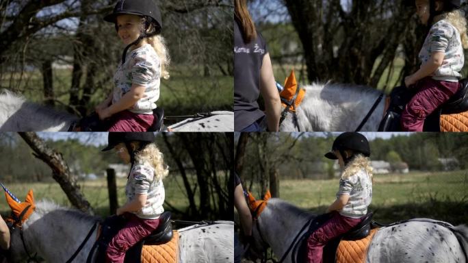 可爱的金发女孩骑着独角兽小马。万向节稳定器运动镜头