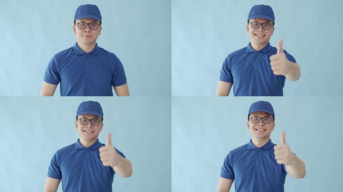亚洲快乐送货员举起大拇指，在蓝色背景上露出笑脸的成功象征。邮政递送服务的概念。