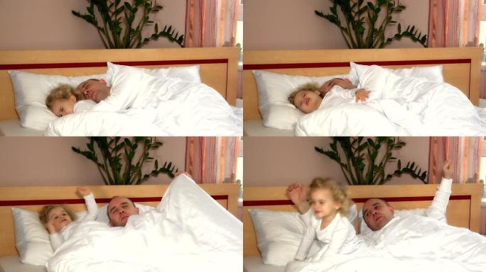 可爱的秃头小女孩父亲早上在卧室醒来
