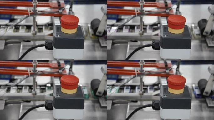 红色按钮启动和停止工厂中的机械