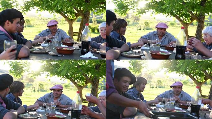 放松的阿根廷高乔家庭在正餐中交谈