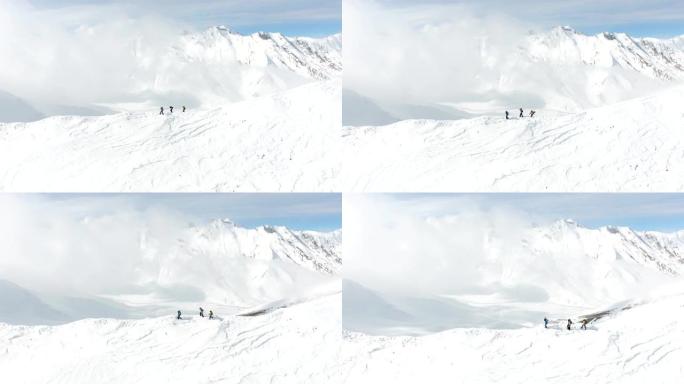 山顶上的一群极端滑雪者。滑雪道斜坡上的自由行。俯视图。佐治亚州高加索山脉，滑雪胜地古达里。