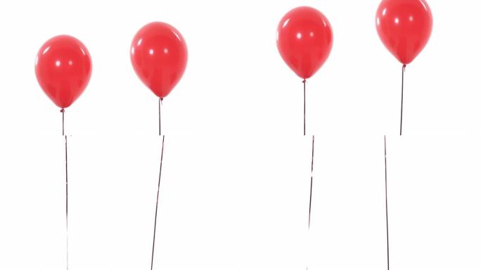 两个红色气球飞起来并从摄像机视野中消失的特写演示视频。孤立，在白色背景上
