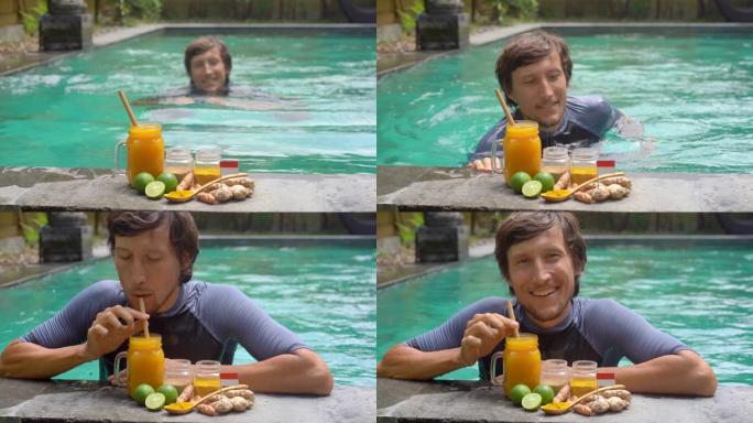 一名年轻人在游泳池里游泳时喝了巴厘岛国民饮料Jamu