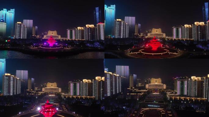 青岛市夜间照明秀市中心著名海岸线广场空中全景4k中国