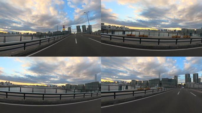 日落时开车穿过桥快速路行车开车第一视角车