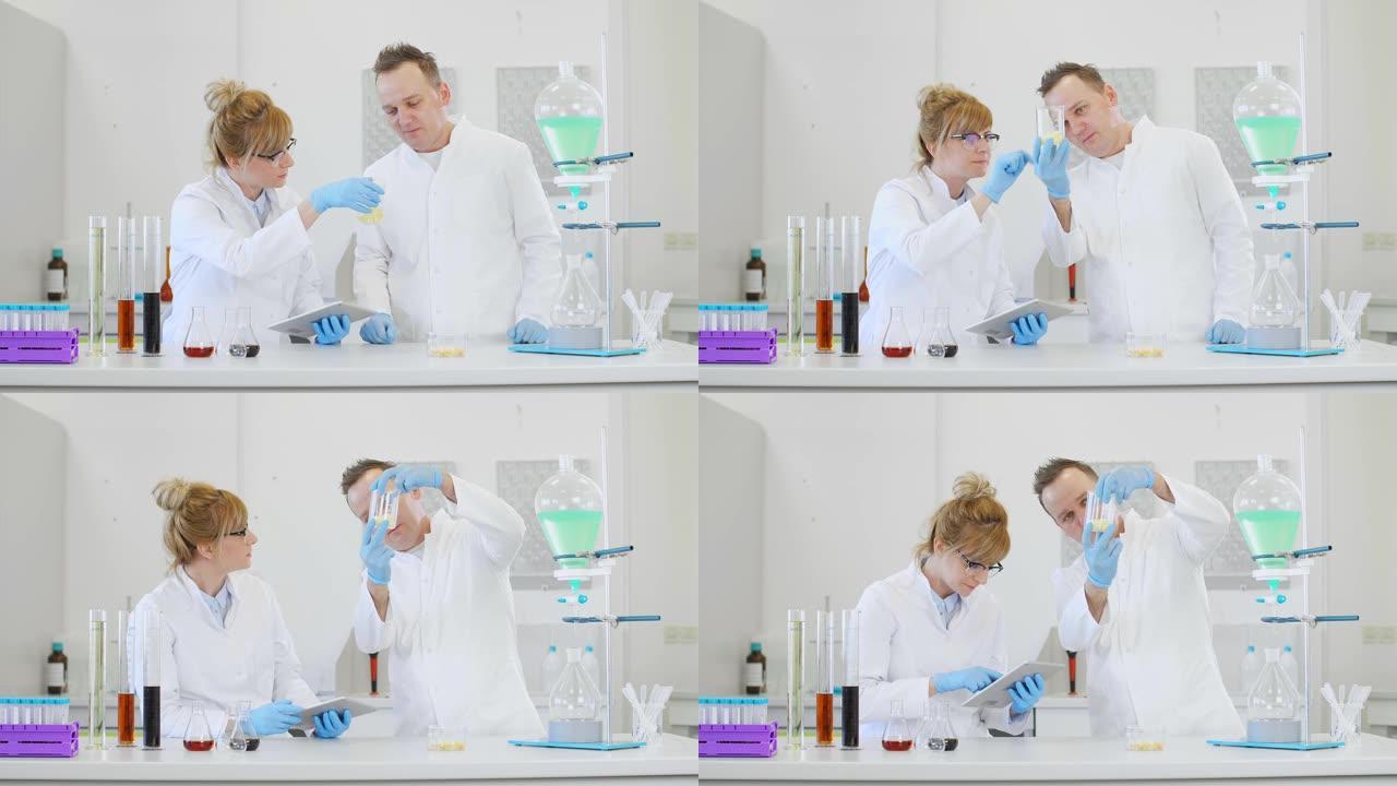 两名科学家正在实验室中研究萜烯晶体和药片
