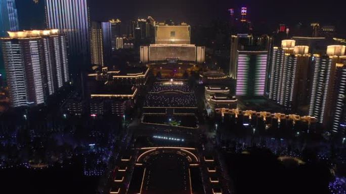 青岛市夜间照明秀市中心著名公园广场空中全景4k中国