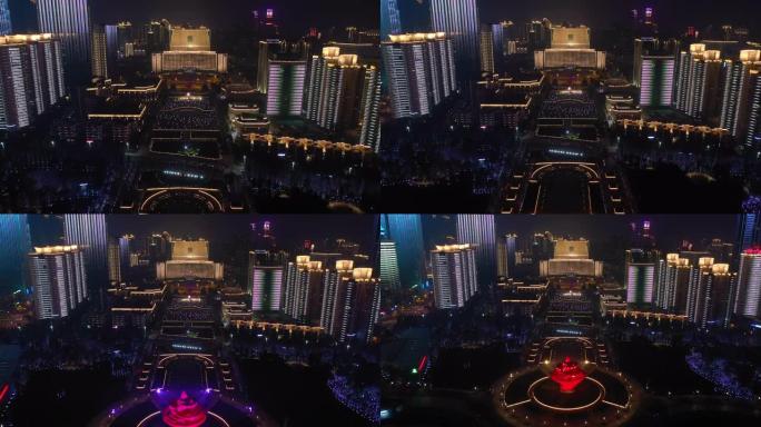 青岛市夜间照明秀市中心著名公园广场空中全景4k中国