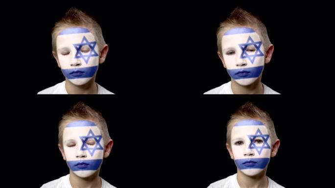 以色列足球队的可怜球迷。脸上涂着民族色彩的孩子。