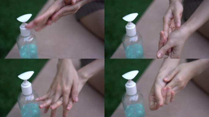 4k女性手部使用洗手液凝胶，搓手防菌，冠状病毒病新冠肺炎，洗手，杀菌，蓝色酒精凝胶瓶，卫生消毒，健康